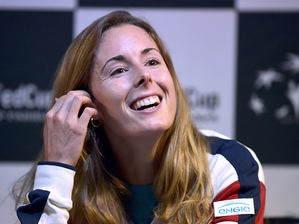 Alize Cornet chats to the press; Getty Images.