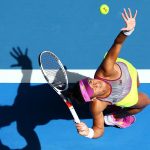 Heather Watson reaches up to fire down a serve in Perth at the Hopman Cup