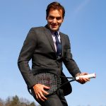 Federer rocks the air guitar. Photo: Getty Images