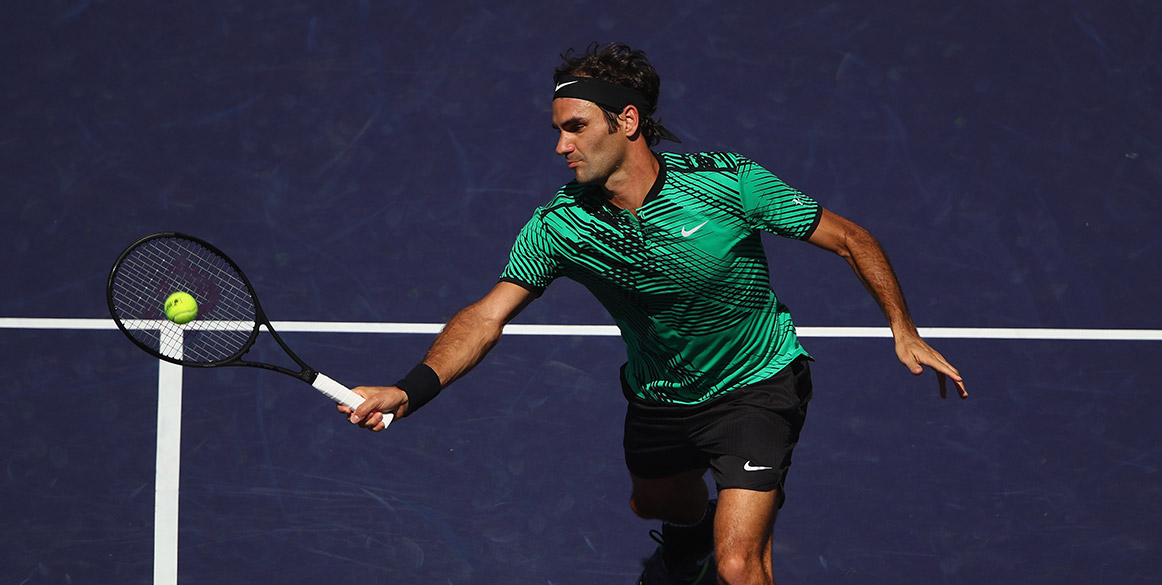 Roger Federer volleys during his BNP Paribas Open semifinal ...