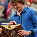 Zverev was presented with a customary pair of lederhosen (and a car, trophy and cheque) following his win. Photo: Getty Images