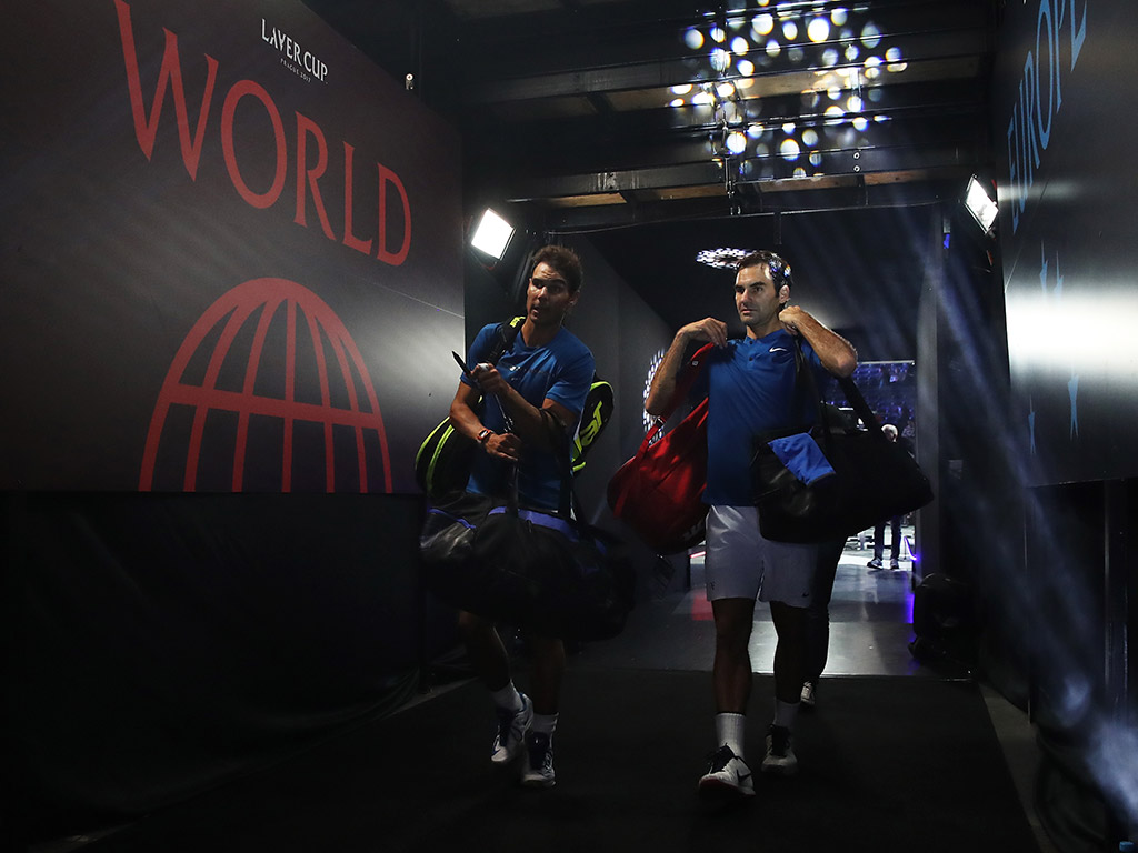 Rafael Nadal (L) and Roger Federer exit the court; Getty Images