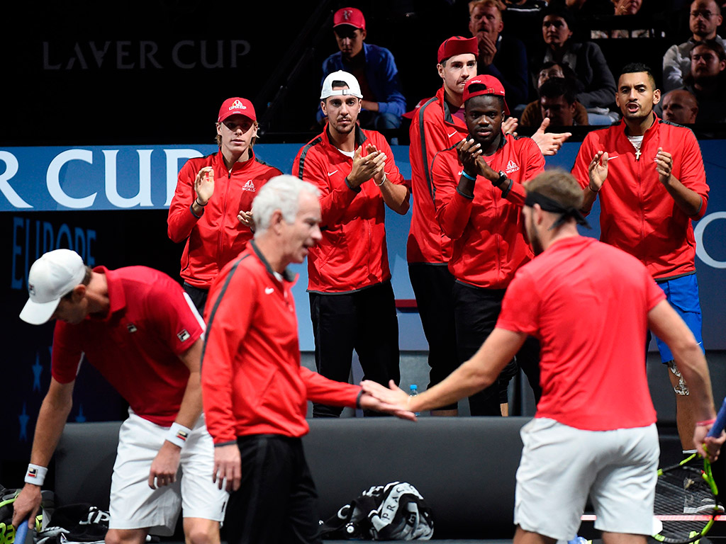Captain John McEnroe urges on his charges as the rest of Team World shows support; Getty Images