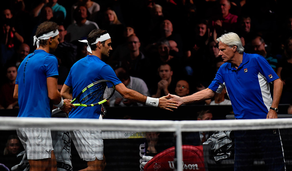 Captain Bjorn Borg (R) offers encouragement to Rafael Nadal (L) and Roger Federer; Getty Images