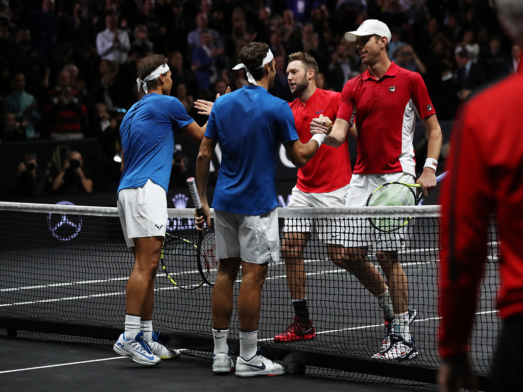 Team Europe and Team World congregate at net after a memorable Laver Cup doubles match; Getty Images