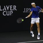 Roger Federer gets to grips with the black court. Photo: Getty Images