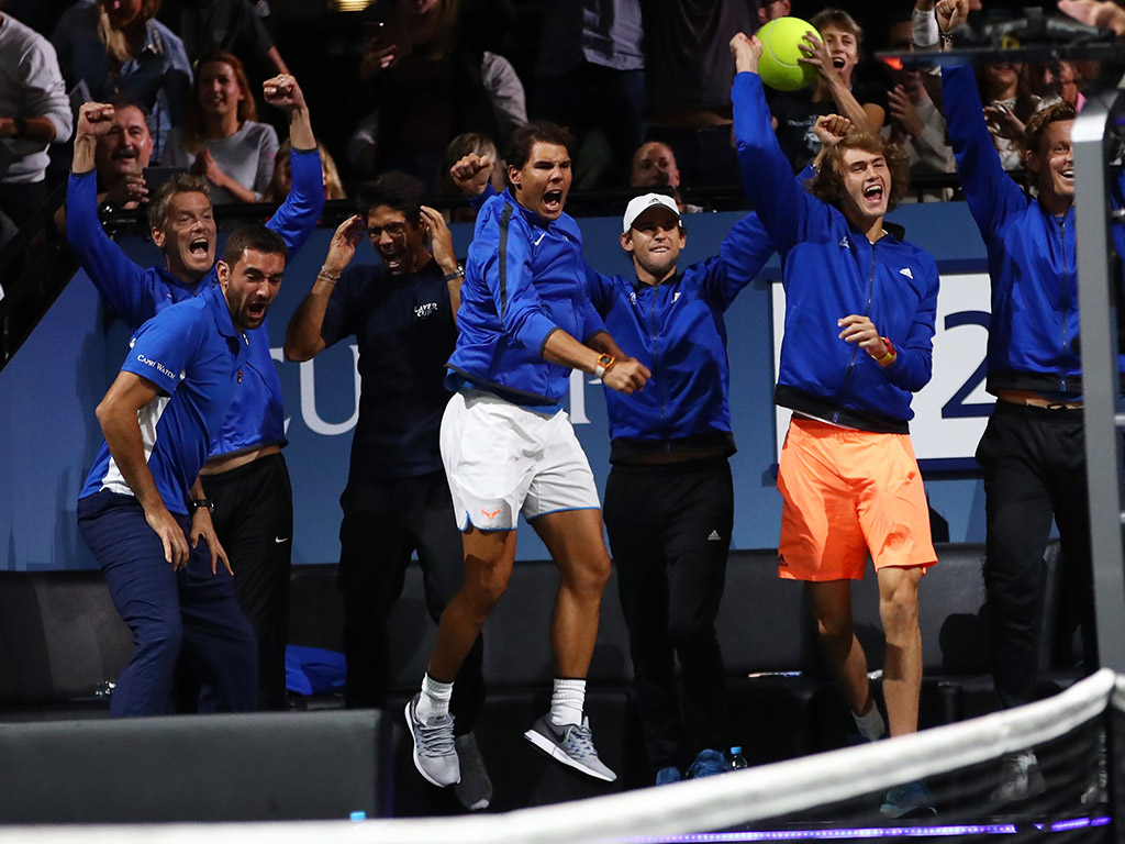 Team Europe celebrates Roger Federer's victory over Nick Kyrgios from the sidelines; Getty Images