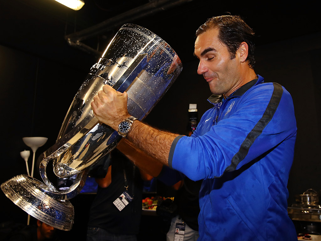 Roger Federer drinks champagne from the Laver Cup; Getty Images
