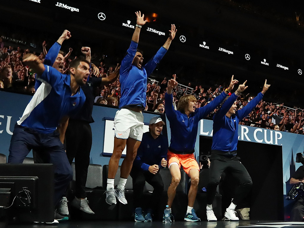 Team Europe celebrates Roger Federer's victory over Nick Kyrgios from the sidelines; Getty Images