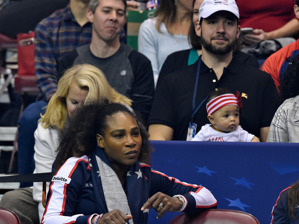 Alexis Ohanian holds baby Alexis Olympia during Serena Williams' return at Fed Cup; Getty Images 
