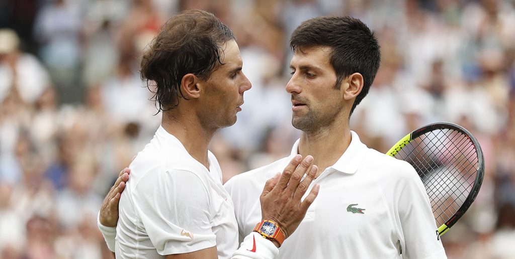 Rafael Nadal (L) and Novak Djokovic meet at net after their epic Wimbledon semifinal. The pair have split two meetings in 2018. (Getty Images)