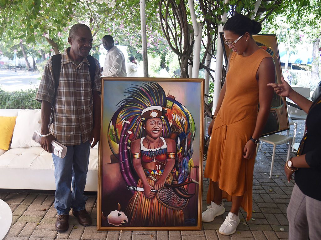 Naomi Osaka receives a gift after her visit to the Haitian National Pantheon Museum in Port-au-Prince, on November 9, 2018. Osaka is on a 5-day visit to Haiti. (HECTOR RETAMAL/AFP/Getty Images)